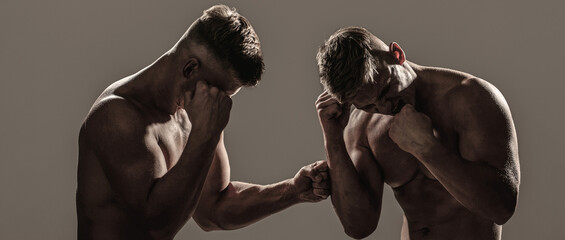 Fototapeta na wymiar Two men boxers boxing on isolated silhouette background. Two men exercising thai boxing in silhouette, MMA