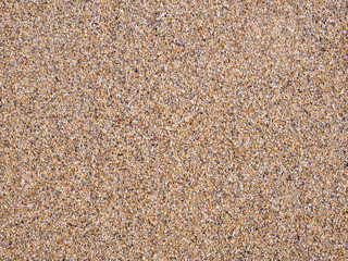 Golden beach sand texture background.