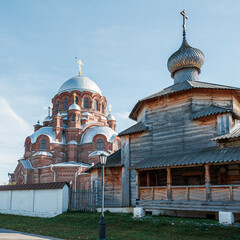 Orthodox brick church and the old wooden church are located next to each other