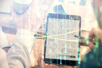 Multi exposure of man's hands holding and using a digital device and data theme drawing. Innovation concept.