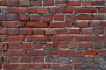 Obraz premium Old, broken wall of red bricks outside, close-up. Textured backdrop