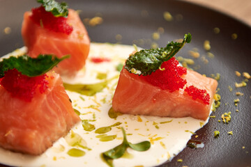 Delicious salmon in restaurant on a wooden table. Tasty seafood with beer in cafe or pub menu.
