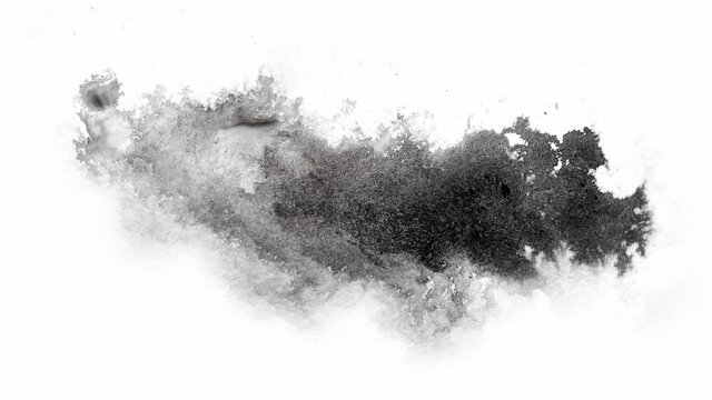 abstract black splashes on white watercolor paper. monochrome image. Movement photo.