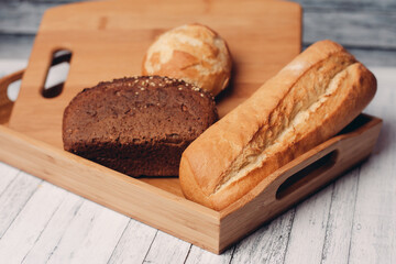 whole grain bread loaves homemade cakes cooking wood board close-up
