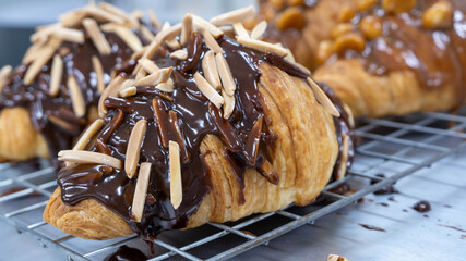 croissant with caramel sauce macadamia nut almond stick  dark chocolate on top