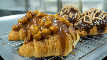 croissant with caramel sauce macadamia nut almond stick  dark chocolate on top