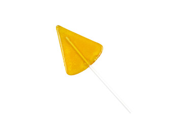 Yellow lollipop on a white stick. White background. Isolated.