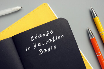  Financial concept meaning Change in Valuation Basis with phrase on the piece of paper.