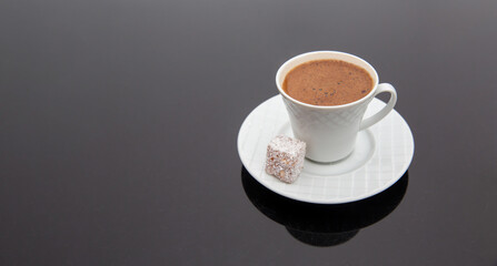 Turkish coffee on wooden table, front view