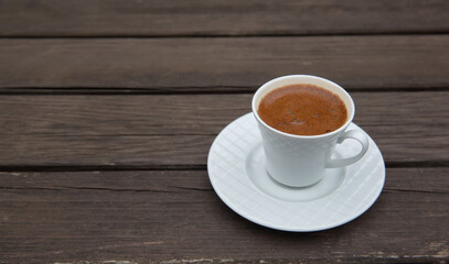 Turkish coffee on wooden table, front view