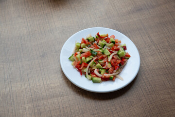 top view, salad in a round white plate