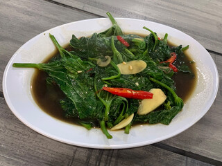 Cah kangkung, kangkong, or water spinach stirred.