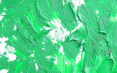 Chaotic paint strokes. Stained green color painted wall surface . rough plaster texture. sloppy...
