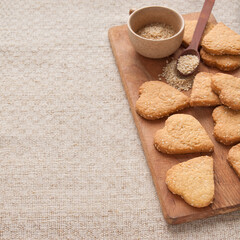 Homemade crispy cookies with sesame seeds in the shape of heart