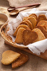 Homemade crispy cookies with sesame seeds in the shape of heart