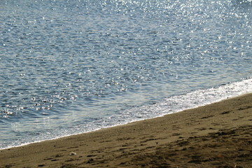 Photo for background material focusing on the waves approaching the sandy beach