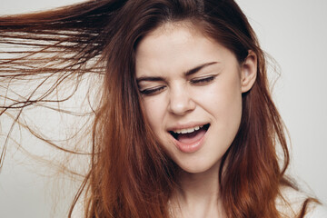 Fototapeta premium woman with comb in hand tangled hair health problems