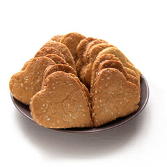 Fototapeta premium Homemade crispy cookies with sesame seeds in the shape of heart