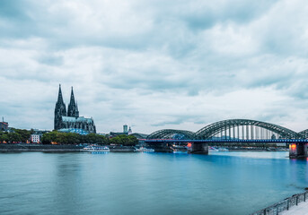 Naklejka premium Rhine promenade in Cologne with a view of Cologne Cathedral at the blue hour, Germany.
