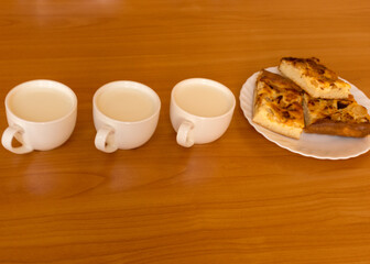 apple pie and white milk cups, school catering concept, lunch for students
