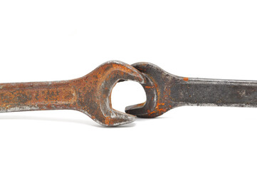 Rusty wrenches, bolts and nuts on white background close up. Tool, old, rare, vintage, macro, DIY, spanner