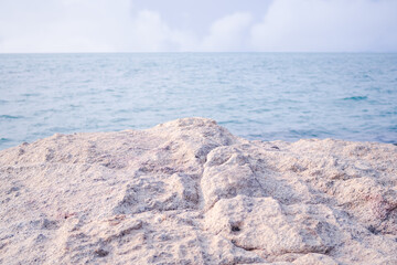 Stone or rock at coast with blue sea and blue sky blured. miracle nature ocean at pattaya thailand. tourist travel summer in holidays concept.