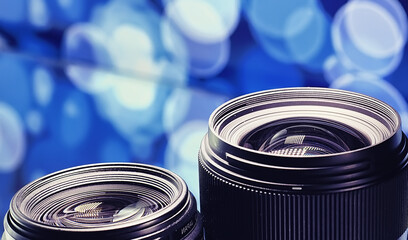 Equipment videographer and photographer. Lenses on the table against the background of bright...