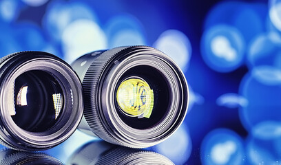 Equipment videographer and photographer. Lenses on the table against the background of bright...