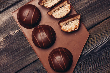 cakes on chocolate bar wooden background dessert delicacy texture