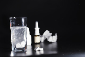 Composition from Bottles of cough syrup.Healthcare, medicine, flu and treatment concept - paper wipes and thermometer with pills.