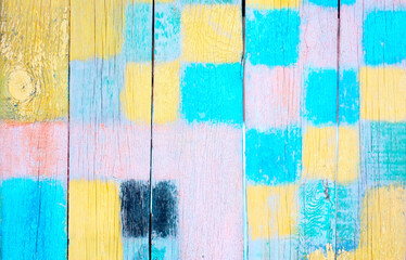 Abstract, colored, wooden background. Texture of painted vertical boards. Old fence. Horizontal image. Free space for text. A copy of the space. Selective focus. Top view.