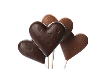 Heart shaped lollipops made of chocolate on white background