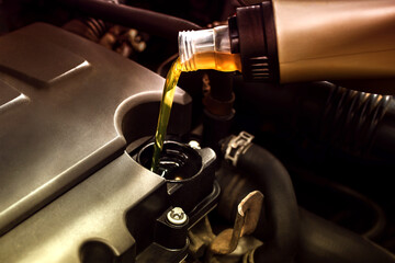 Refueling and pouring oil quality into the engine motor car Transmission and Maintenance Gear.Energy fuel concept.