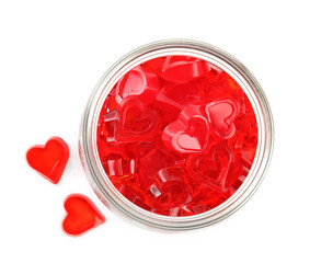 Tasty heart shaped jelly candies on white background, top view