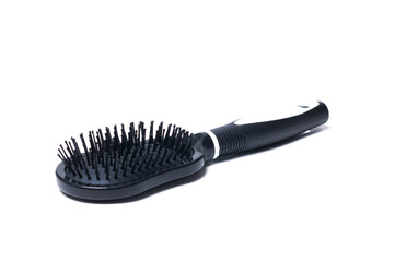 Plastic black professional hair brush on white background