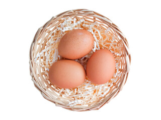 Eggs in a basket isolated on a white background. View from above