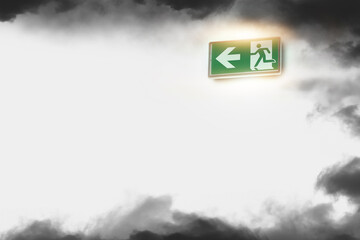 Emergency exit sign and fire smoke on the white wall background