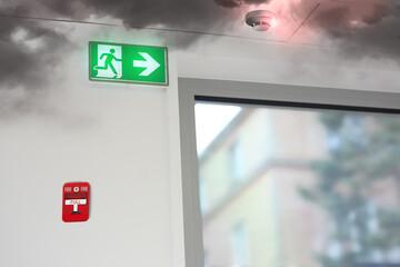 fire and smoke activates the alarm and smoke detector in the office room - 422027146
