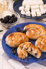 Pastry swirls with cheese and olive filling.
