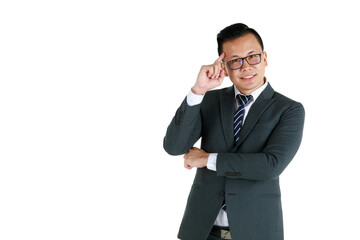 Young and handsome businessman executive look, wearing dark gray suit and eyeglasses standing with friendly face and self-confidence with hand touch head in thinking gesture