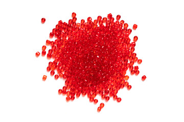 Pile of red beads isolated on white background. Bead crochet. Beading. Top view