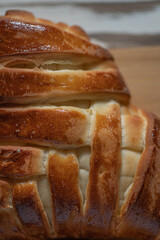 Appetizing fresh homemade buns on a wooden background, close-up.