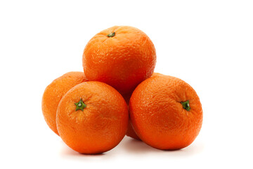 Several oranges lie on a white background with a shadow
