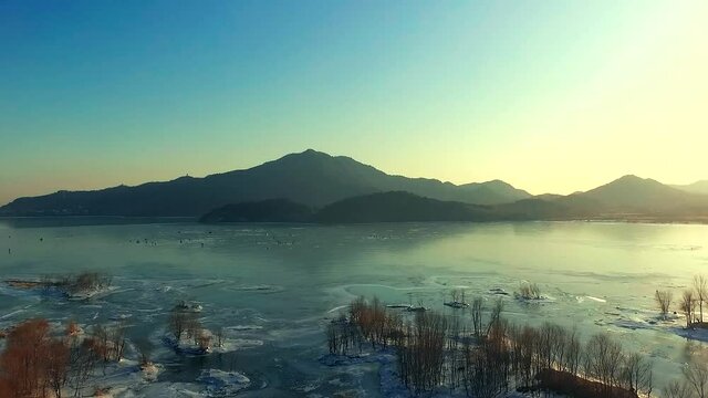 Aerial photos of the Ming Tombs Reservoir in winter and the frozen ice surface of the reservoir in winter