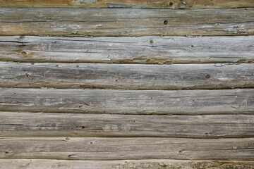 Old log wall worn out in the open air