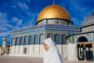 woman standing near  Dome of the Rock Mosque near Jerusalem