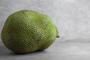Delicious exotic jackfruit on light grey table. Space for text