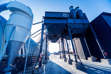 Naklejka premium Industrial metallic construction at background with clear sky