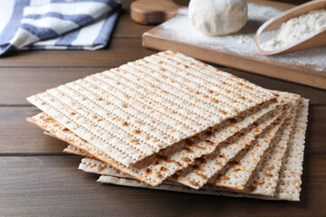 Stack of traditional matzos on wooden table