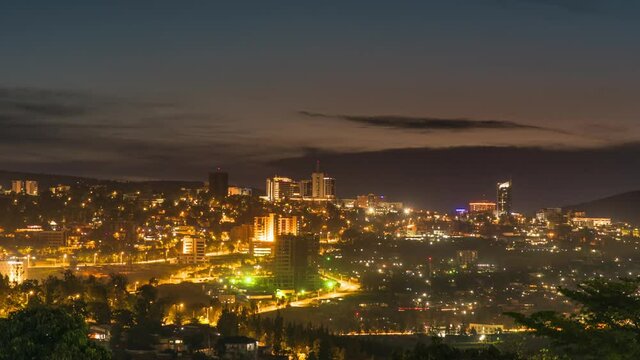 Timelapse video of Kigali city centre skyline and surrounding areas showing a darkening sky at night. Rwanda